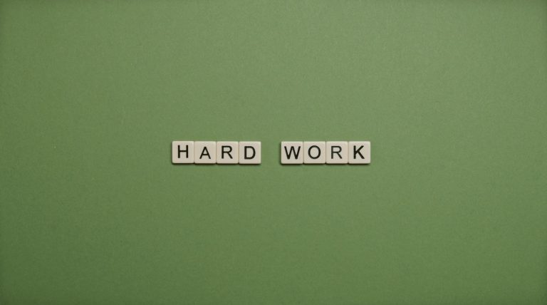 Hard Work Text On Green Background